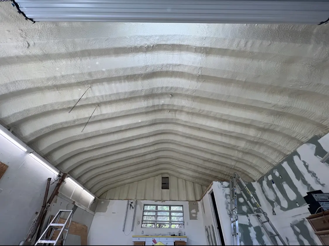 Spray polyurethane foam applied to the underside of a metal roof deck in Pimmit Hills